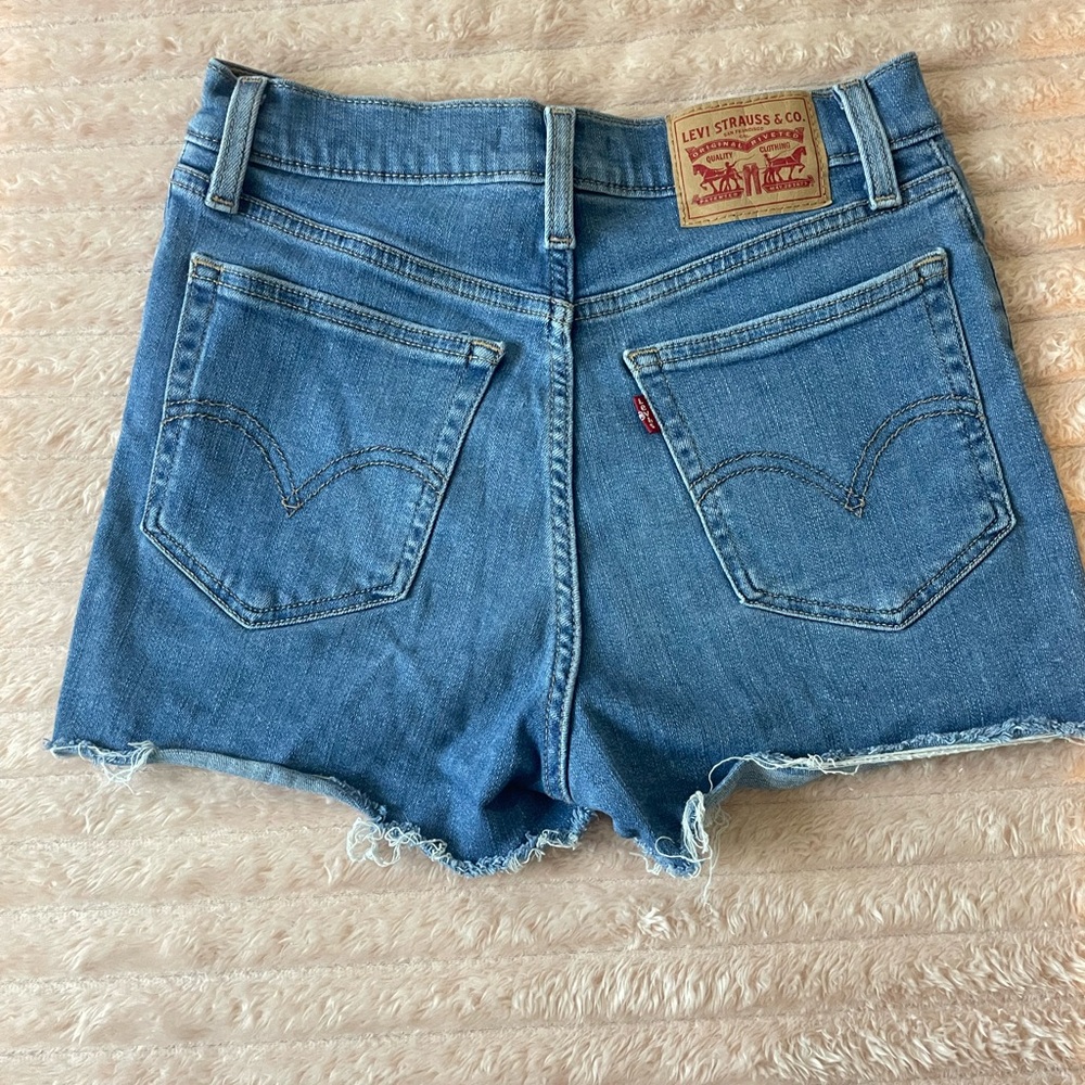 Levi's Medium Blue Denim Frayed Hem Cutoff Shorts
